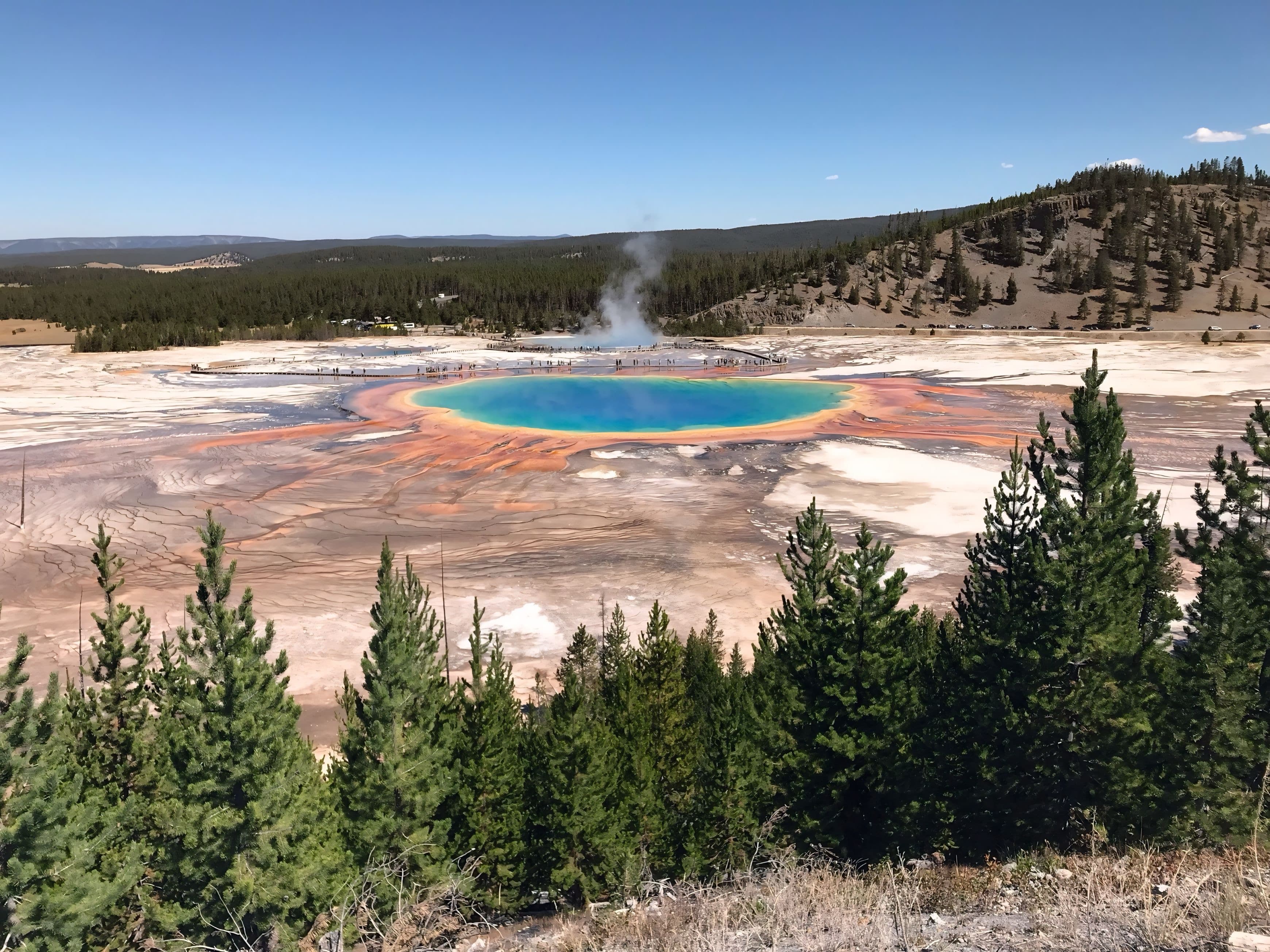 Geothermal landscape with steam and mineral-rich hot springs